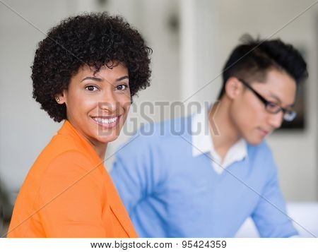 Two desingers working on a project together in office