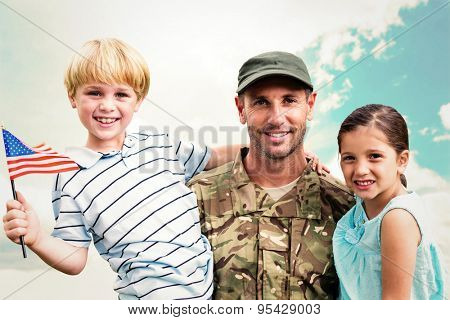 Soldier reunited with his children against blue sky