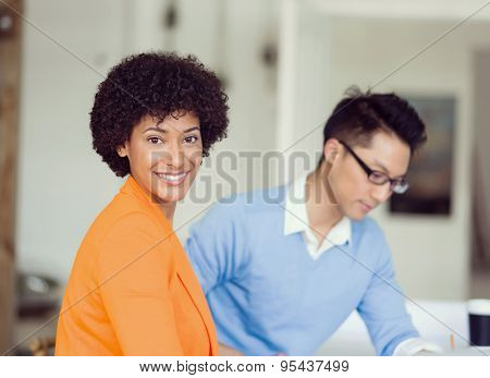 Two desingers working on a project together in office