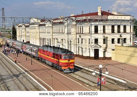 TULA, RUSSIA - MAY 23, 2015: Passenger train on the railroad station Moskovsky. The station building was erected in 1913 and then reconstructed in 1952-1955