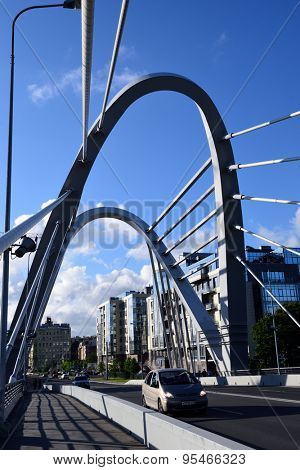 ST. PETERSBURG, RUSSIA - JUNE 27, 2015: Traffic on the Lazarevsky bridge across the Small Nevka River. New cable-stayed bredge was built in 2009 instead of old wooden bridge