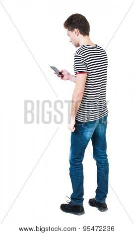  back view of man in suit  talking on mobile phone.    rear view people collection. Isolated over white background. backside view of person. The guy in the striped shirt looking at the cell phone.