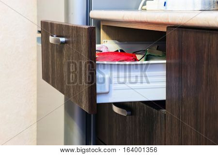 Open drawer with in it different things 1