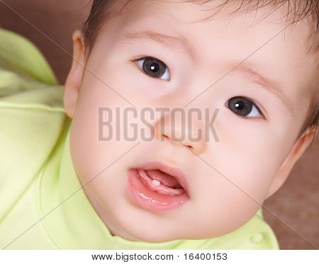 Baby with first tooth