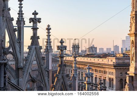 Roof of the Milan Cathedral with spiers at sunset