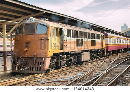 BANGKOK, THAILAND - DECEMBER 13, 2016: Trains waits at a platform of railway station Hua Lamphong in Bangkok. Hua Lamphong opened in 1916 and serves apprx 70,000 passengers and 150 trains each day.