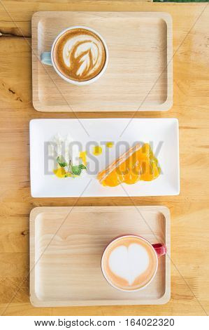 Heart coffee cup milk in a coffee shop Delicious coffee cake