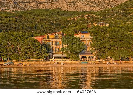 TUCEPI, CROATIA - September 20, 2016 Private houses by the sea illuminated by the sunshine.