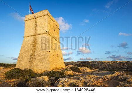 Malta - Ghajn Tuffieha watchtower at Golden Bay before sunset