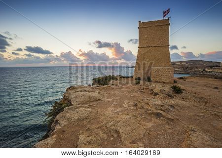Malta - Ghajn Tuffieha watchtower at Golden Bay before sunset