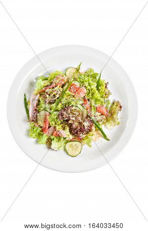 Salat with meat and lettuce on the plate