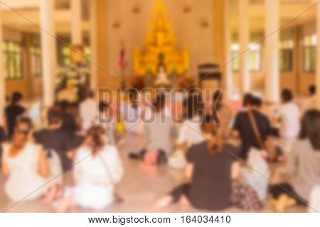 Abstract blur he monks and Thai Buddhist are praying in church in day time can be used as background