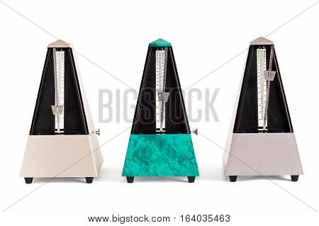 Three pyramid shaped metronomes in plastic housing isolated on white