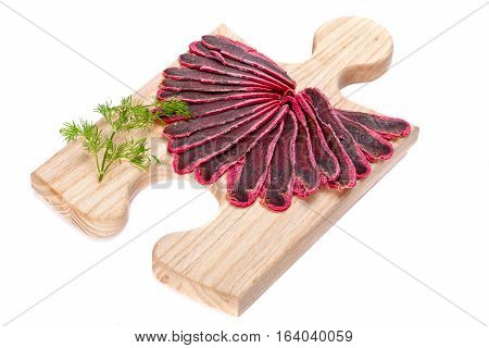 Meat delicious basturma on wood board  isolated on white background.