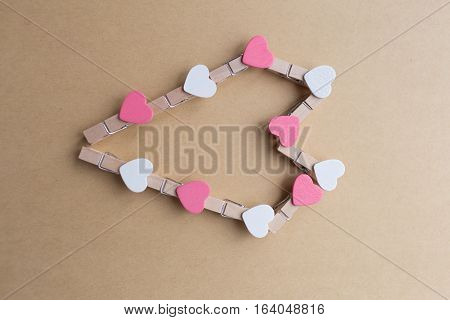 Clothespins with hearts are Notepad. Background is blue paper