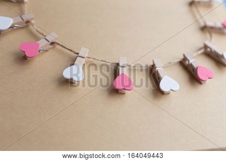 Clothespins with hearts are Notepad. Background is blue paper
