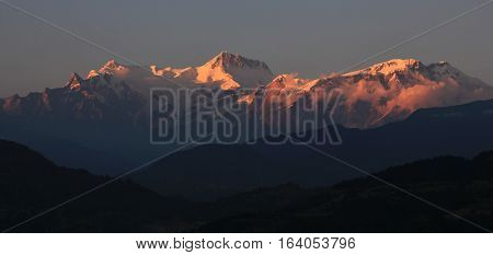 View from Begnas Tal. Peaks of the Annapurna range lit by the last sunlight of the day.
