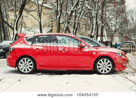Smolensk, Russia - November 12, 2016: New Mazda 3 (Axela) parked in winter street. Is a compact car manufactured in Japan by Mazda.