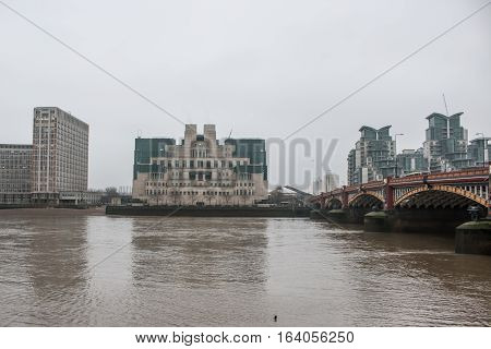 London, UK - 19 december 2016: Building of Secret Intelligence Service MI6 in London, in a grey foggy day