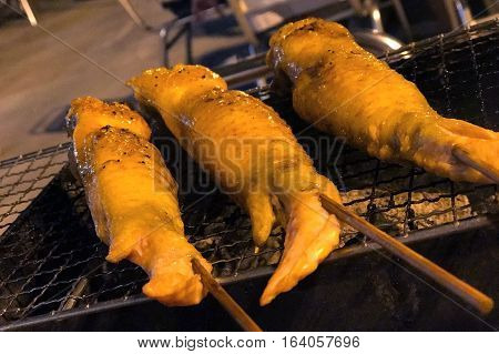 Outdoor Barbecue Chicken Wing On Metal Net Grilled
