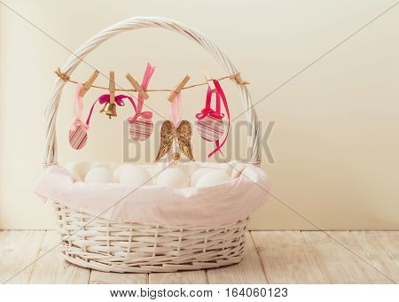 Easter basket with eggs and Easter decor.