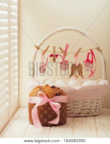 Easter cake and basket with eggs and Easter decor.