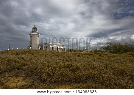 Los Morrillos lighthouse in Puerto Rico under dramatic skies.
