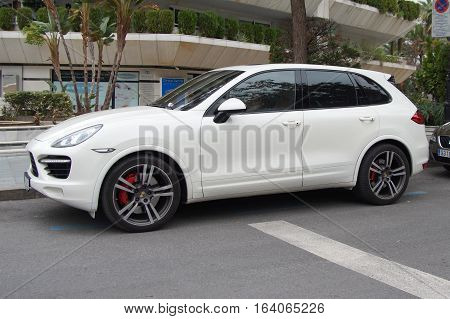 Marbella, Andalusia, Spain - December 31, 2016: Porsche Cayenne MPV parked on a public parking spot. Nobody in the vehicle.