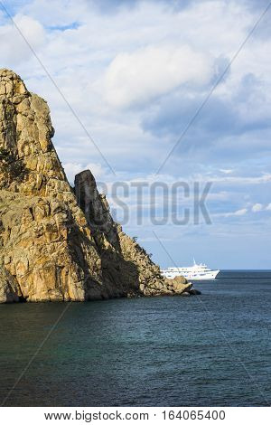 The white ship looks picturesque against the gathering clouds over lake Baykal