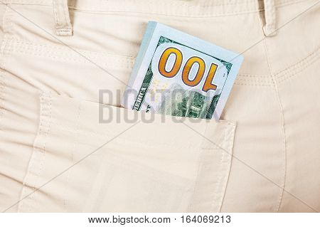 Heap banknotes of american dollars in the back jeans pocket