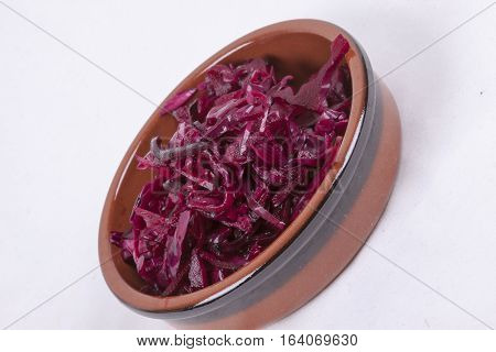 photo of pot of red coleslaw isolated on a white background