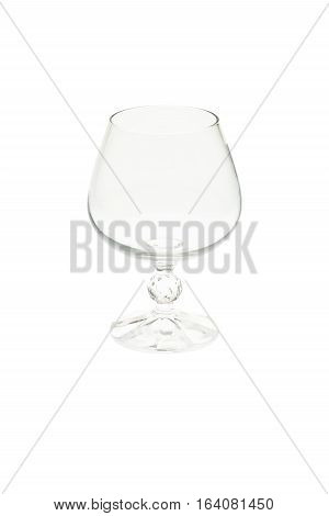 Isolated empty cognac glass, brandy snifter on white background