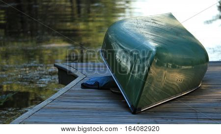 A canoe sits overturned awaiting the journey ahead.