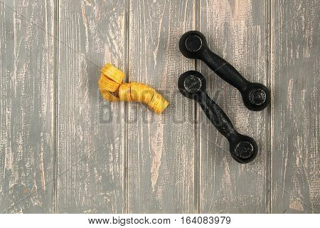 Dumbbells on drey floor. Stock photo Sporty mock up