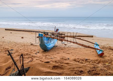 Fishing boat on the sand beach. Indian ocean. Sri Lanka.