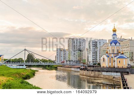 BELGOROD RUSSIA - JULY 04 2016: Belgorod cityscape. Embankment river Vezelka with a view of the temple Archangel Gabriel.