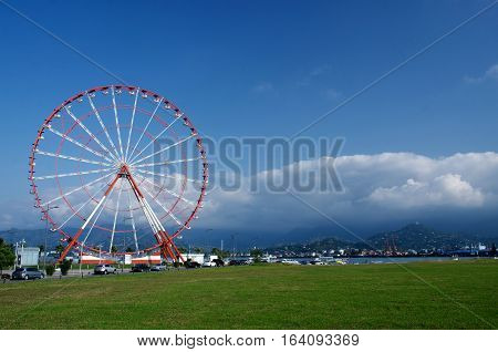 Ferris wheel on Batumi seafront with Caucasus mountains on the background ,Black Sea,Georgia,Adzharia