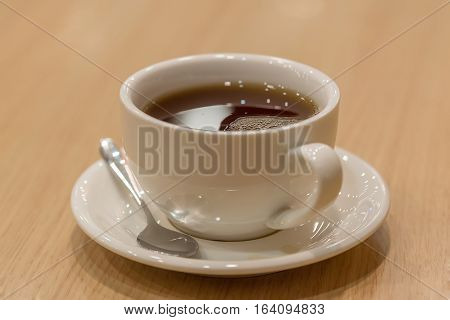 Morning cup of tea drinking on balcony on flower background
