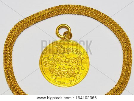 In China, gold pendant on a white background.