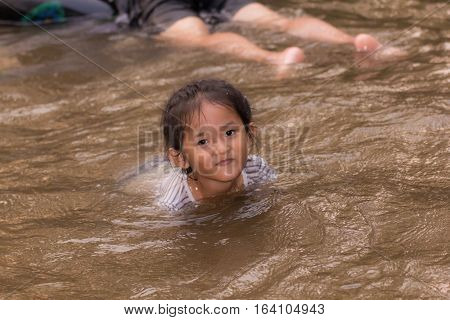asia girl in river , thai children