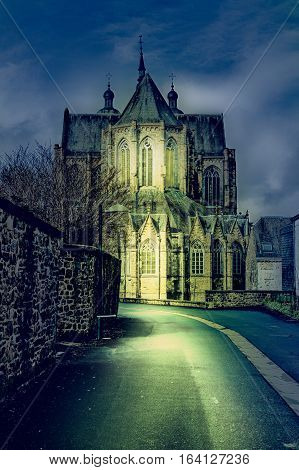 The street leading to the church in Belgium. Cathedral of St. Hubert in Belgium at Night
