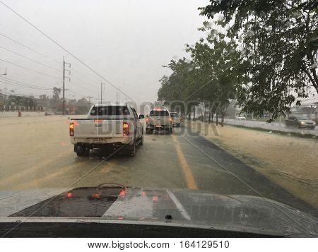 PATTALUNG, THAILAND, JAN 4, 2017: Water flooding on the street in Thailand