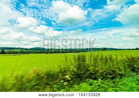 landscapes of agricultural fields photographed from the car near blackford town in the Highlands Scotland