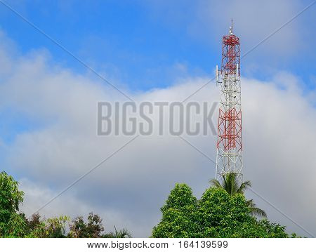 Antenna and cellular tower in blue sky background