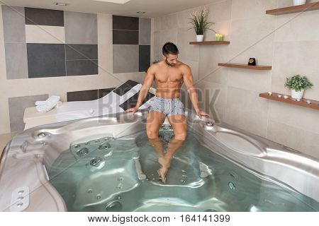 Handsome Relaxed Man In Jacuzzi Spa