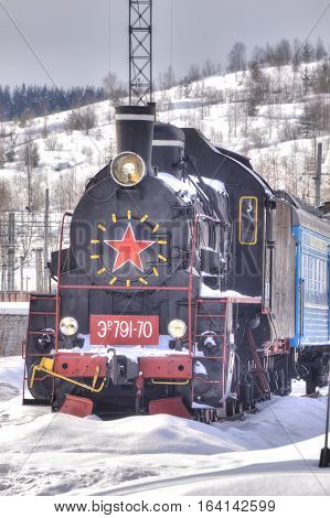 MURMANSK RUSSIA - March 27.2009: Railway station. Old steam locomotive on the siding