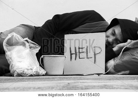 Homeless person sleep on sidewalk of the street