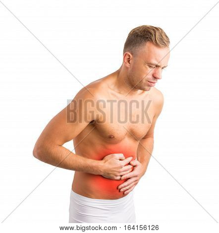 Man in pain holding his hurting stomach