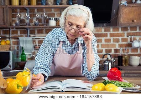 Senior Woman With Cookbook