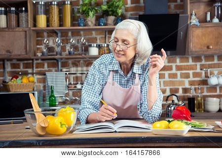 Senior Woman With Cookbook